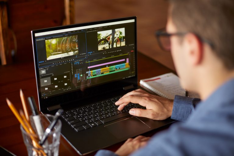 man using video editing software