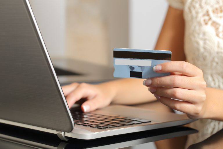 Woman buying online with a credit card ecommerce