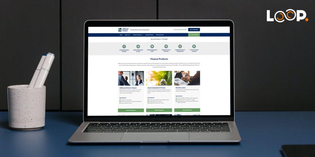 example brochure website build on a laptop in dark setting - millbrook business finance