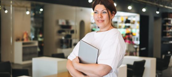 Business Owner holding laptop
