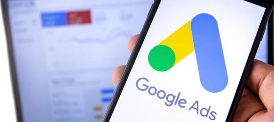 Google Ads app on laptop and phone