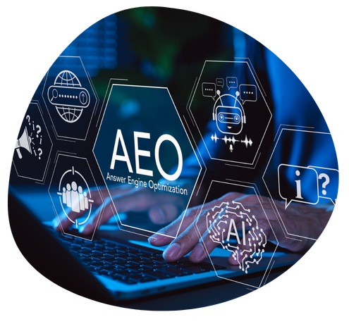 Hands typing on a laptop, AEO strategy words